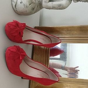 Red suede pumps
